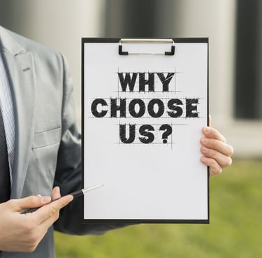 A man holding a paper with pad behind it stating Why choose US ? this image is used on national pneumatic systems website.