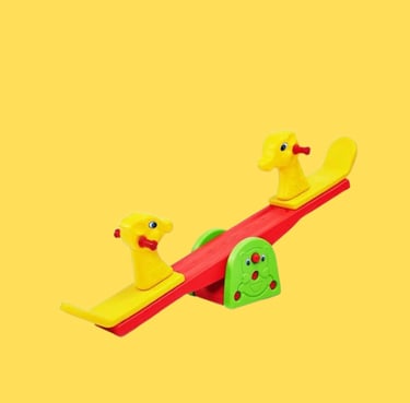 a pair of ducks and ducks on a seesaw