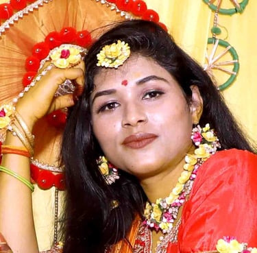 a woman in a red dress and a fan. kaya studio Dholpur