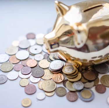 golden piggy bank and coins representing savings and saving money for financial goals and retirement