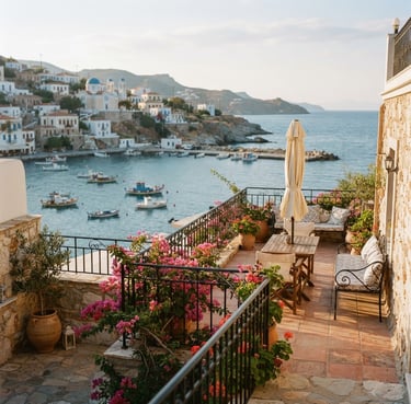 Medium-long shot of an empty sun-drenched terrace overlooking a quiet Mediterranean harbor, soft morning light, warm sand and muted ocean tones, 35mm editorial photography.