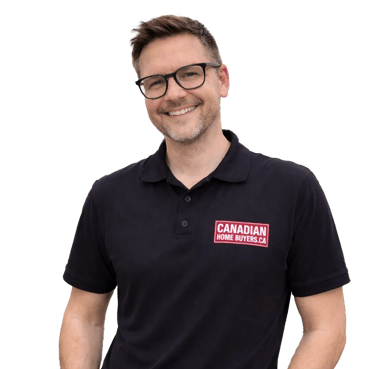 A smiling male real estate professional wearing a Canadian Home Buyers polo shirt.