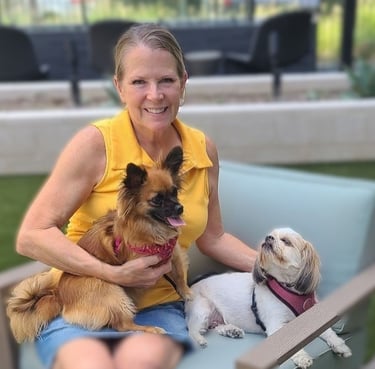 Lady sitting with two dogs