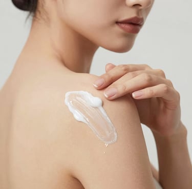 A smiling woman applying lotion on her hands in a bright, cozy room.