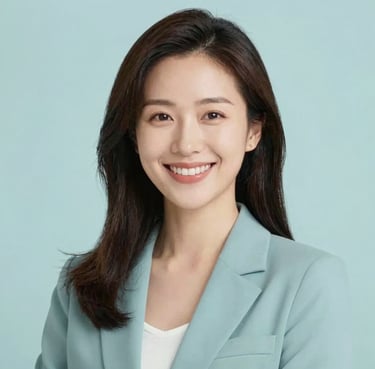 A portrait of a smiling woman in her 30s with a kind and empathetic expression, wearing professional yet soft clothing in a bright studio. Soft lighting with brand palette #8FBBA6 accents.