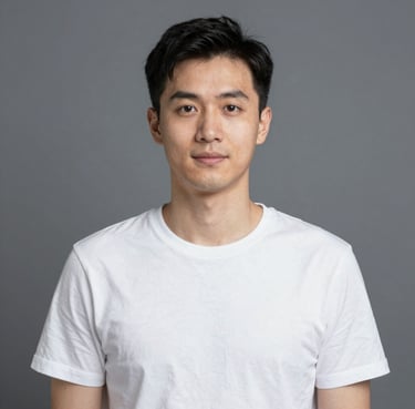 Smiling man standing next to a sleek black car in a modern showroom.