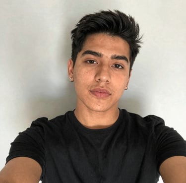 A smiling customer giving a thumbs up in a cozy, well-lit room.