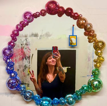 Selfie of Grayson in rainbow disco ball mirror 