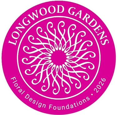 Pink circular logo for Longwood Gardens Floral Design Foundations 2026 with a white swirl pattern.