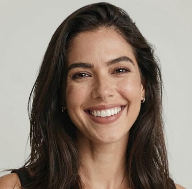 Portrait of a confident woman smiling warmly in a modern office setting.