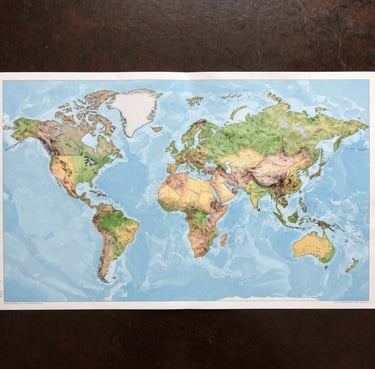 A warm, inviting pediatric consultation room with colorful children's drawings on the walls.