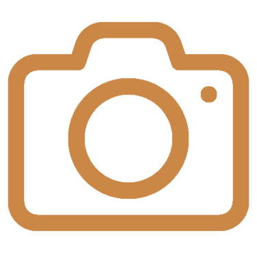 A brown DSLR camera line icon representing photography, media, or digital imaging.