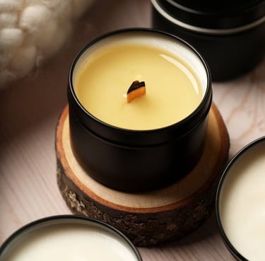 a candle with a candle on a wooden table