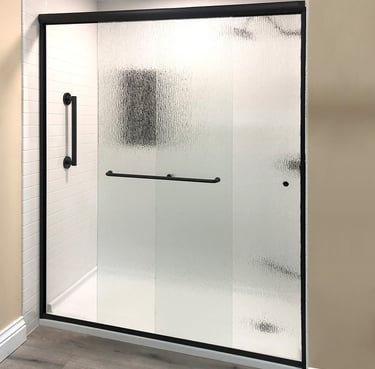 Frosted glass shower with black hardware installed by Toledo New Bath.