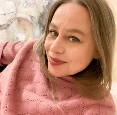 Close-up on Stefanie wearing a pink jumper.