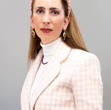 a woman in a pink jacket and pink hairband