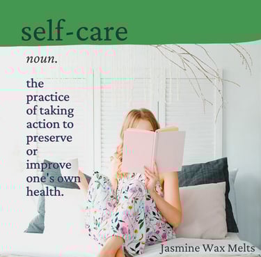 Cayla Henri: a woman sitting on a couch with a book in front of her