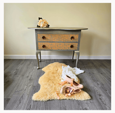 A painted vintage dressing table with stencilled drawers