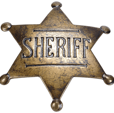 Vintage brass six-pointed star sheriff badge with an aged patina and embossed lettering on a black b