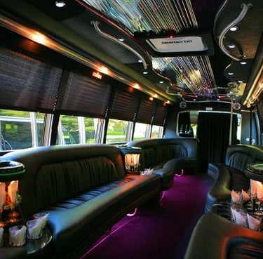 Luxury party bus interior with LED lighting, leather seating, and premium sound system for weddings 