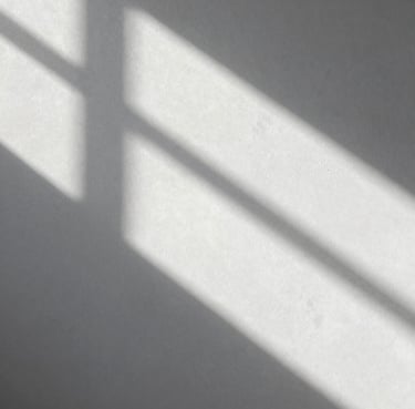 Abstract play of light and shadow on a white textured wall in a minimalist style. Clean gray and white palette. International / Professional.