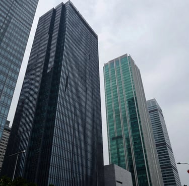 Sharp corporate photography of modern steel and glass skyscrapers in Delhi NCR, cool overcast daylight, architectural angle, 35mm