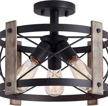 Matte black rustic flush mount ceiling light for warm living room ambiance.