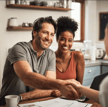Caring professional meeting a couple in their home — representing trust, calm, and meaningful income