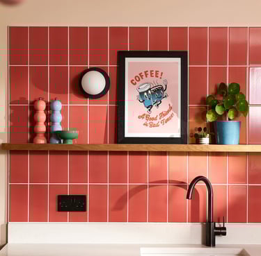 Glossy coral wall tiles with white grout in a modern kitchen splashback, featuring pastel pink