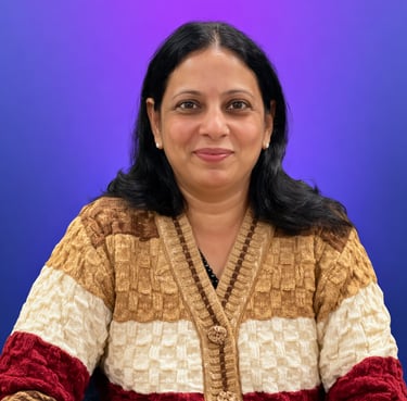 Professional portrait of a smiling woman wearing a textured knit cardigan against a solid purple background.