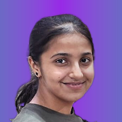 Professional headshot of a smiling young woman with dark hair against a solid purple background.