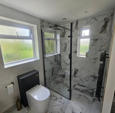 Selection of Nuova Home Improvements bathroom and kitchen projects, featuring walk‑in showers, frees
