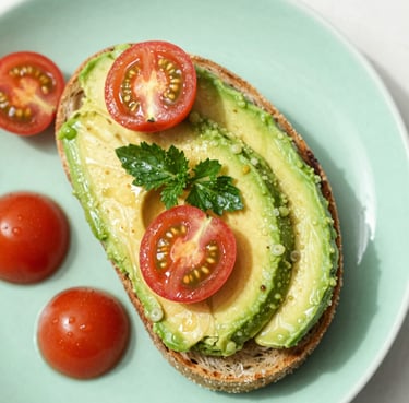 Overhead flat-lay of a vibrant avocado toast with cherry tomatoes and fresh herbs on a mint green plate, bright natural daylight, wet texture, macro lens