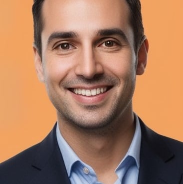 a man in a suit and tie smiling
