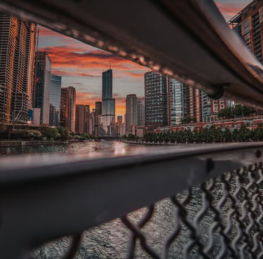 a city skyline view of the Chicago river with a bridge and a bridge