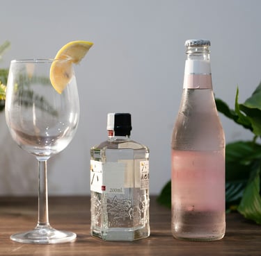 a bottle of gingeze with a glass of gin.Guest Experience Enhancement with Timea Pokol