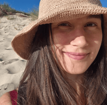 Megan Sydney sacred weekend participant smiling in hat