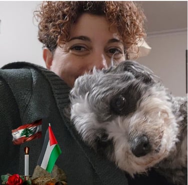 Hala G sacred healing weekend participant, smiling with dog
