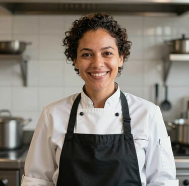 Portrait of a Brazilian female chef in a professional kitchen, smiling warmly at the camera, soft natural lighting, modern Scandinavian kitchen aesthetic.