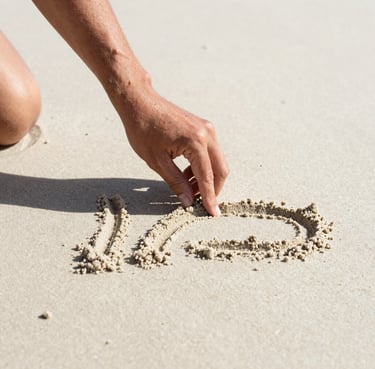 Candid medium shot of a hand gently etching lines into soft sand off-white beach, warm sun-drenched lighting, deep charcoal grey shadows defining the texture.