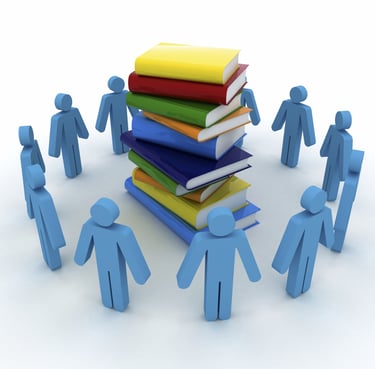 Graphic of a circle of people shapes looking at a pile of books.
