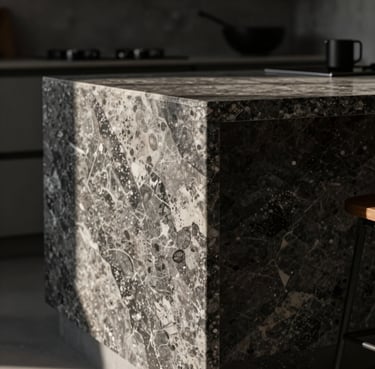 Architectural close-up of a monolithic kitchen island made of dark veined quartz sinter, perfect 45-degree miter joint, dramatic side-lighting casting long shadows, 35mm lens