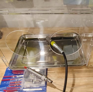 Silver jewelry being polished to a smooth, reflective finish.