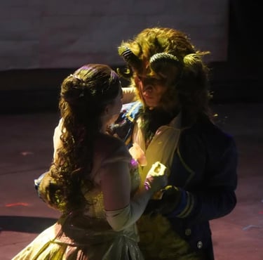 young actor and actress as Beast and Belle in Las Vegas