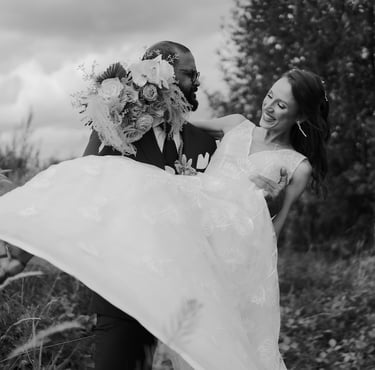 a bride and groom are holding their wedding dress