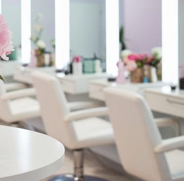 a vase with pink flowers in a salon