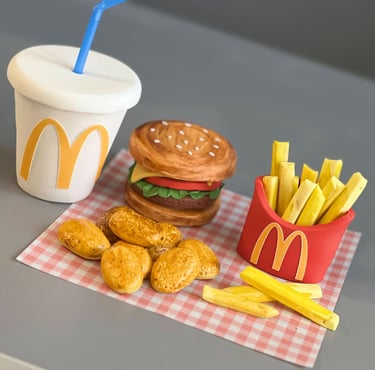 Fondant topper showing burger, nuggets, fries and drink