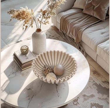 Scalloped decorative bowl styled on a modern coffee table in a cozy neutral living room