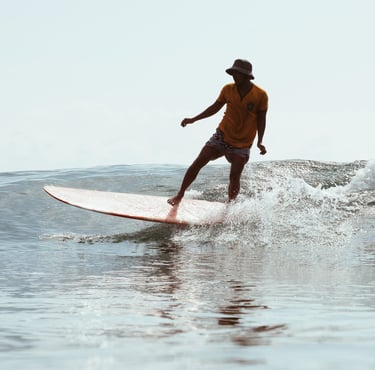 Reki Ucup's student surfing in Batukaras