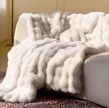 a couch with a blanket on it